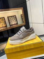 Taupe Fendi chunky lace-up sneakers on display, white midsole and side logo detail