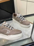 Taupe Fendi chunky sneakers, lace-up with white sole and side logo, angled side view