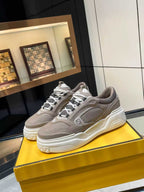 Taupe Fendi chunky lace-up sneakers with white sole and logo detail, unisex design