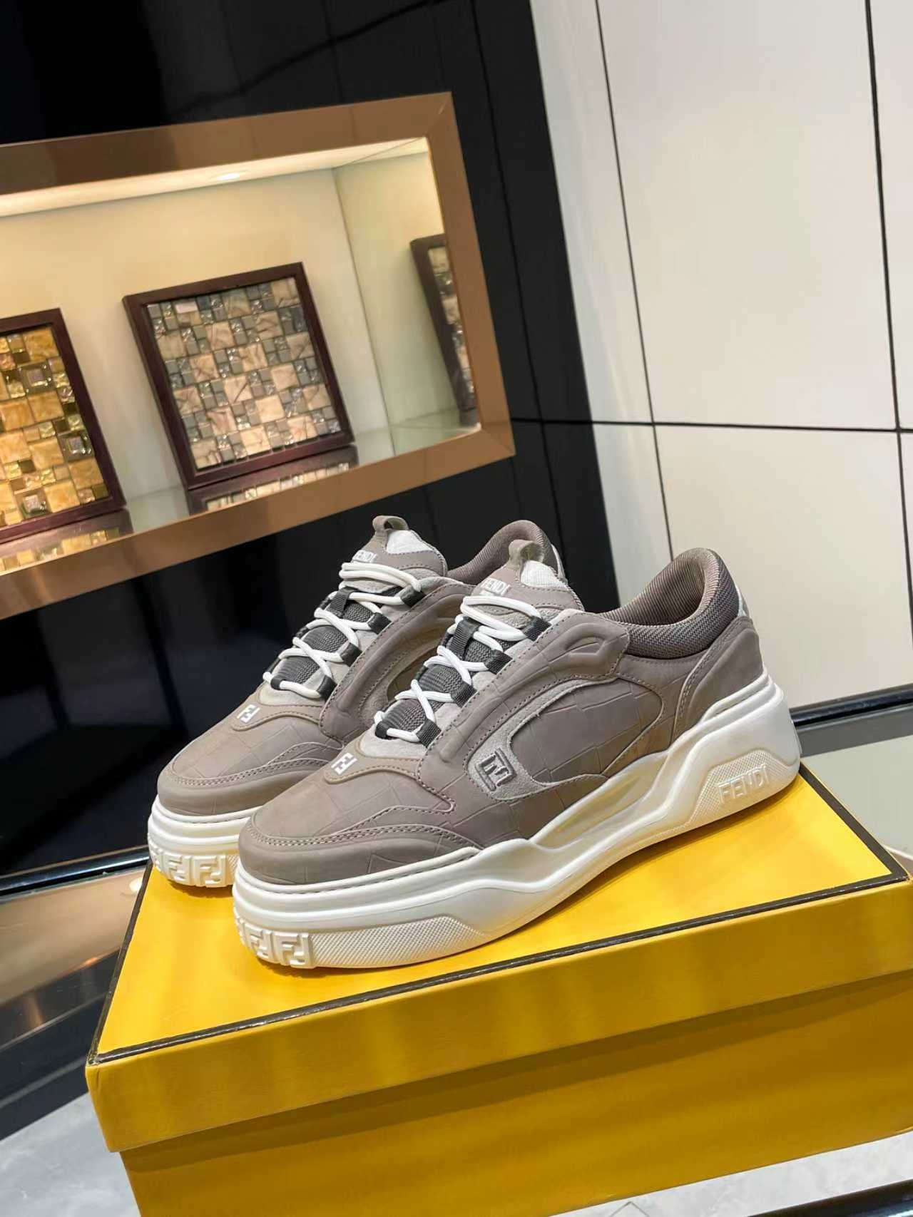 Taupe Fendi chunky lace-up sneakers with white sole and logo detail, unisex design