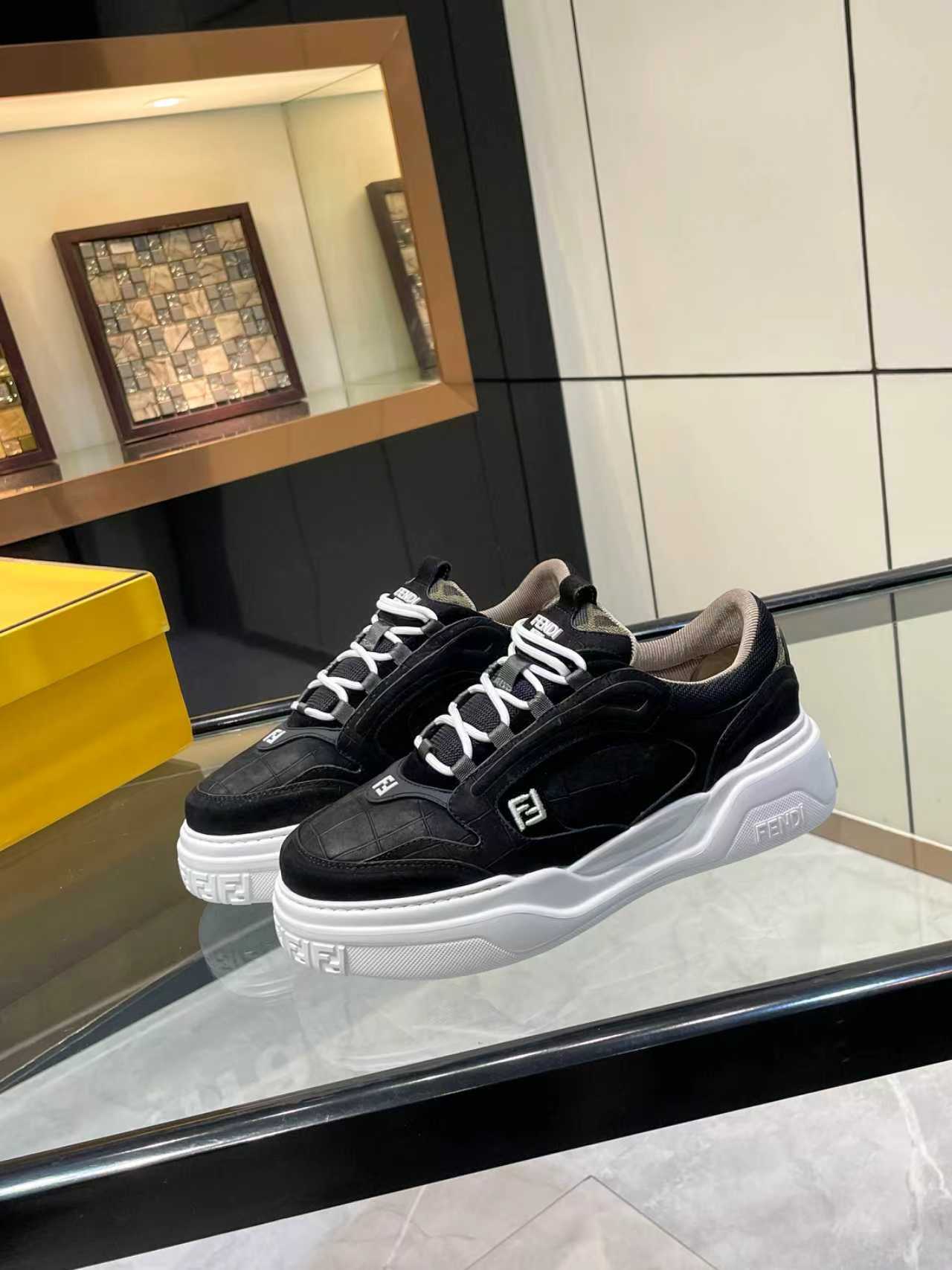 Black lace-up sneakers on white outsole with Fendi logo side details