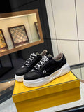 Black lace-up sneakers with white chunky sole and Fendi logo accents