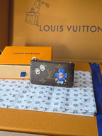 Louis Vuitton small bag with zip top, monogram print and blue cartoon character.