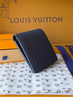 Small bag: Louis Vuitton blue leather card wallet angled view with front logo