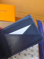 Small bag: Louis Vuitton blue leather card wallet open with card slots visible