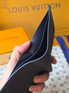 Small bag: Louis Vuitton blue leather card wallet held open showing interior