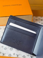 Small bag: Louis Vuitton blue leather card wallet back side with stitched edges