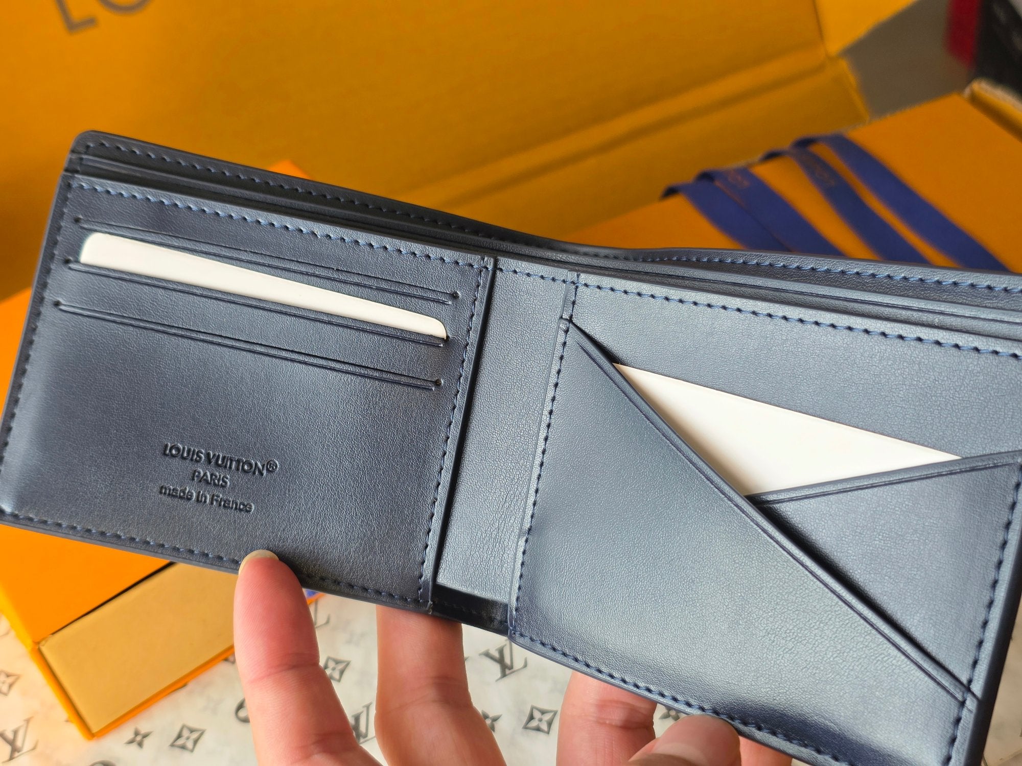 Small bag: Louis Vuitton blue leather card wallet open with card slots and pocket