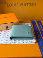 Light blue small bag wallet with flap closure and Louis Vuitton monogram