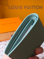 Light blue small bag wallet side view with open interior lining
