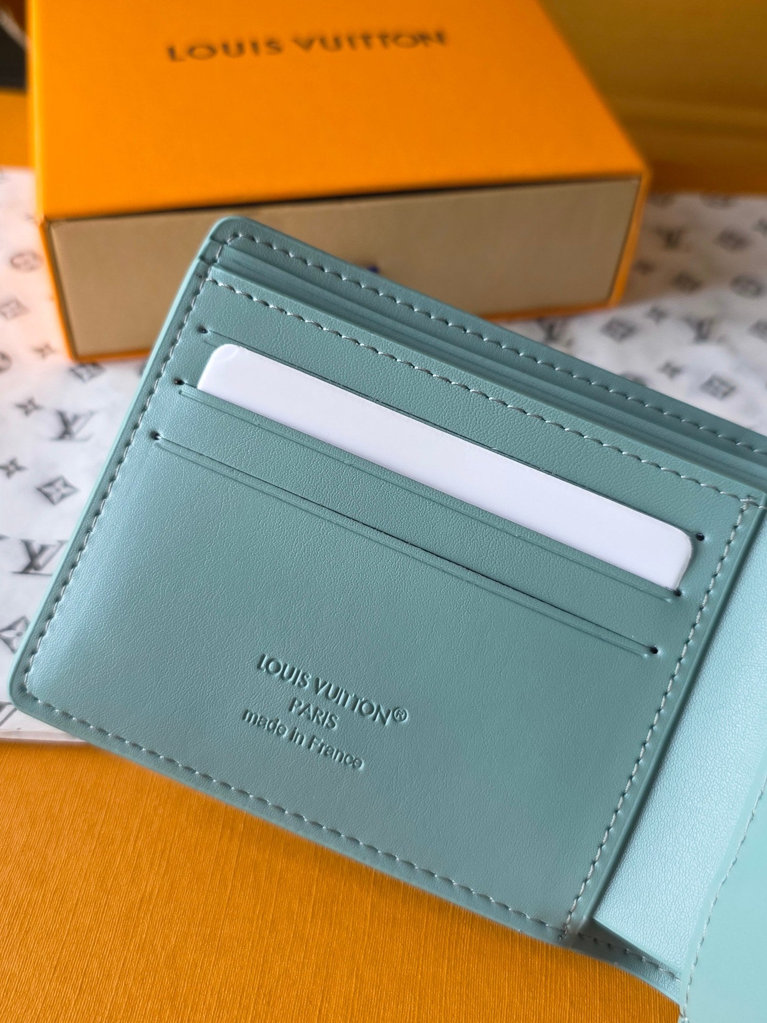 Light blue small bag wallet with card slot and printed text panel