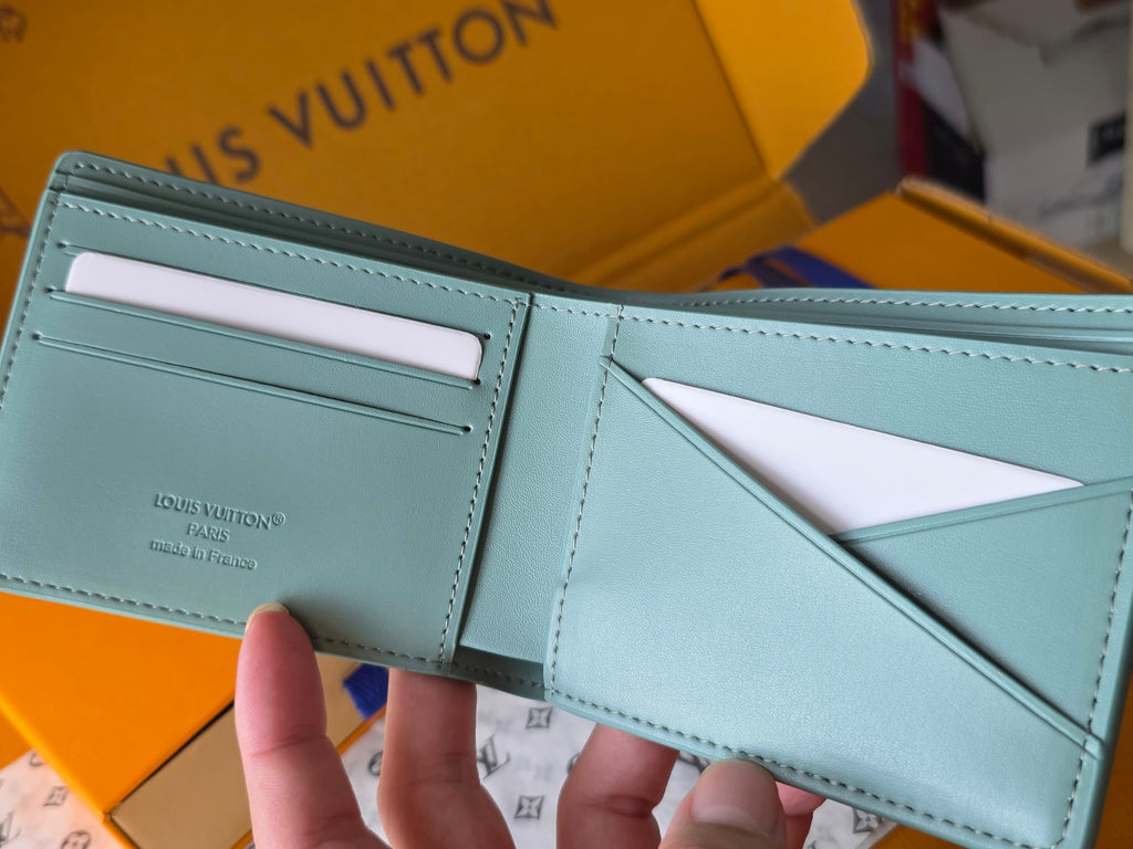 Light blue small bag wallet with card slots and interior panel