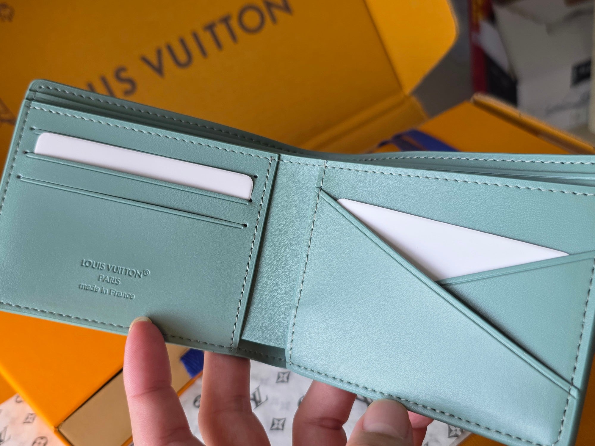 Light blue small bag wallet with card slots and interior panel