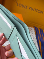 Small bag strap in light teal leather with stitched edges
