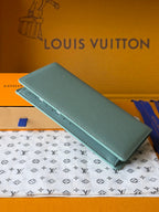 Light blue leather small bag with flap and perforated strap detail