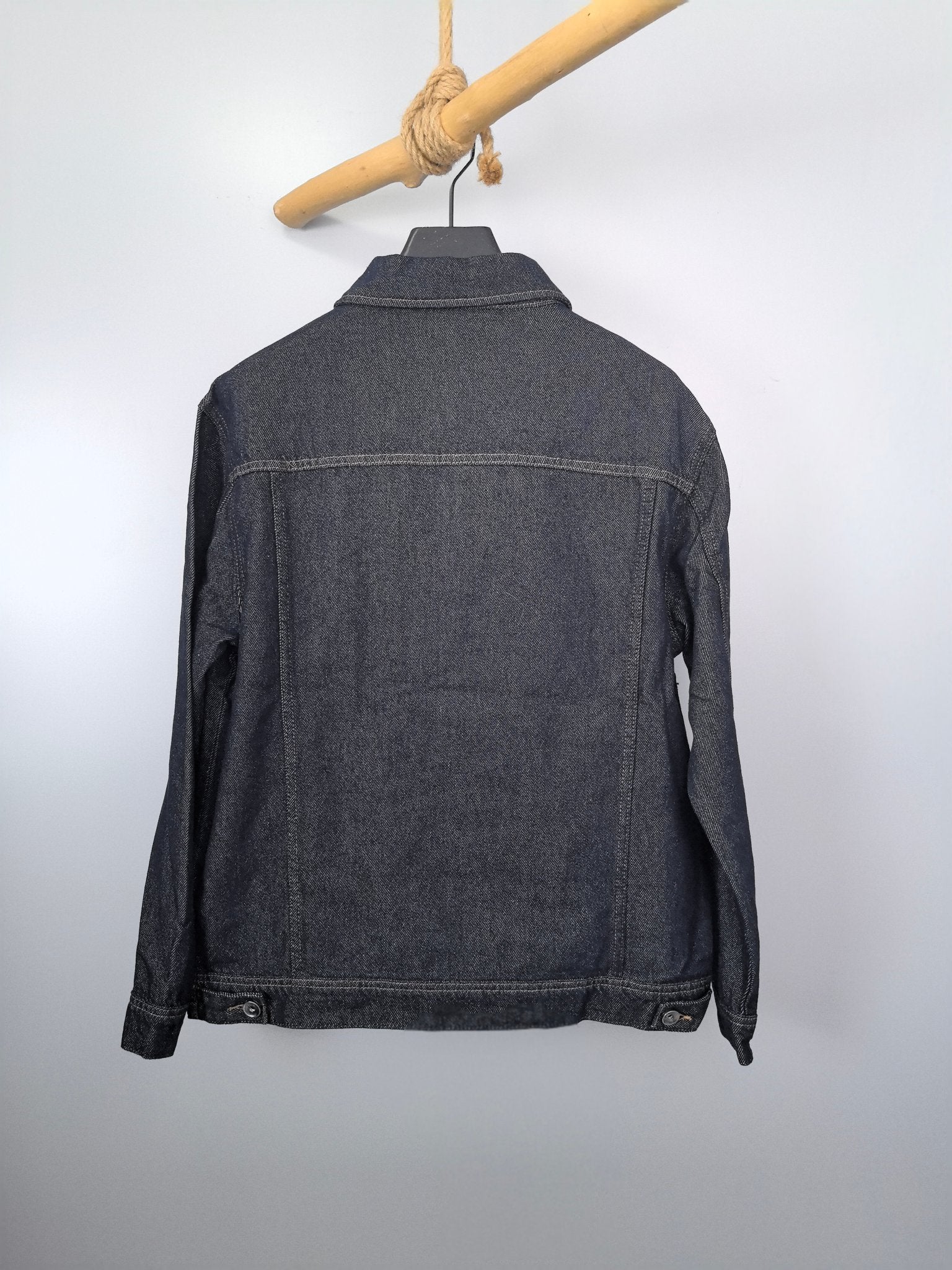 Moncler dark denim jacket back view with buttoned hem and standard shoulder seams