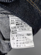 Moncler denim jacket interior care label with printed fabric and washing information