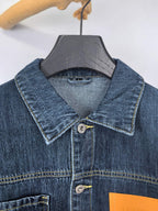 Blue denim jacket close-up of point collar and button front