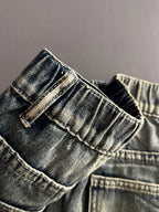 Denim pants pocket and waistband close-up with belt loops and button