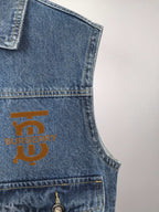 Burberry denim vest chest area with gold logo patch and stitched pocket