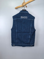 Gucci blue denim sleeveless vest, back view with GUCCI lettering and bottom buttons