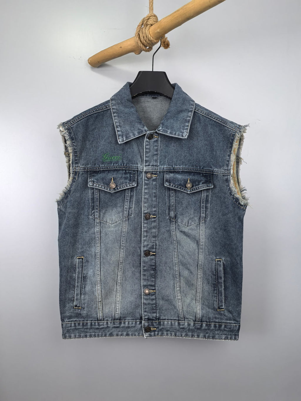 Gucci blue denim sleeveless jacket with button front and flap chest pockets