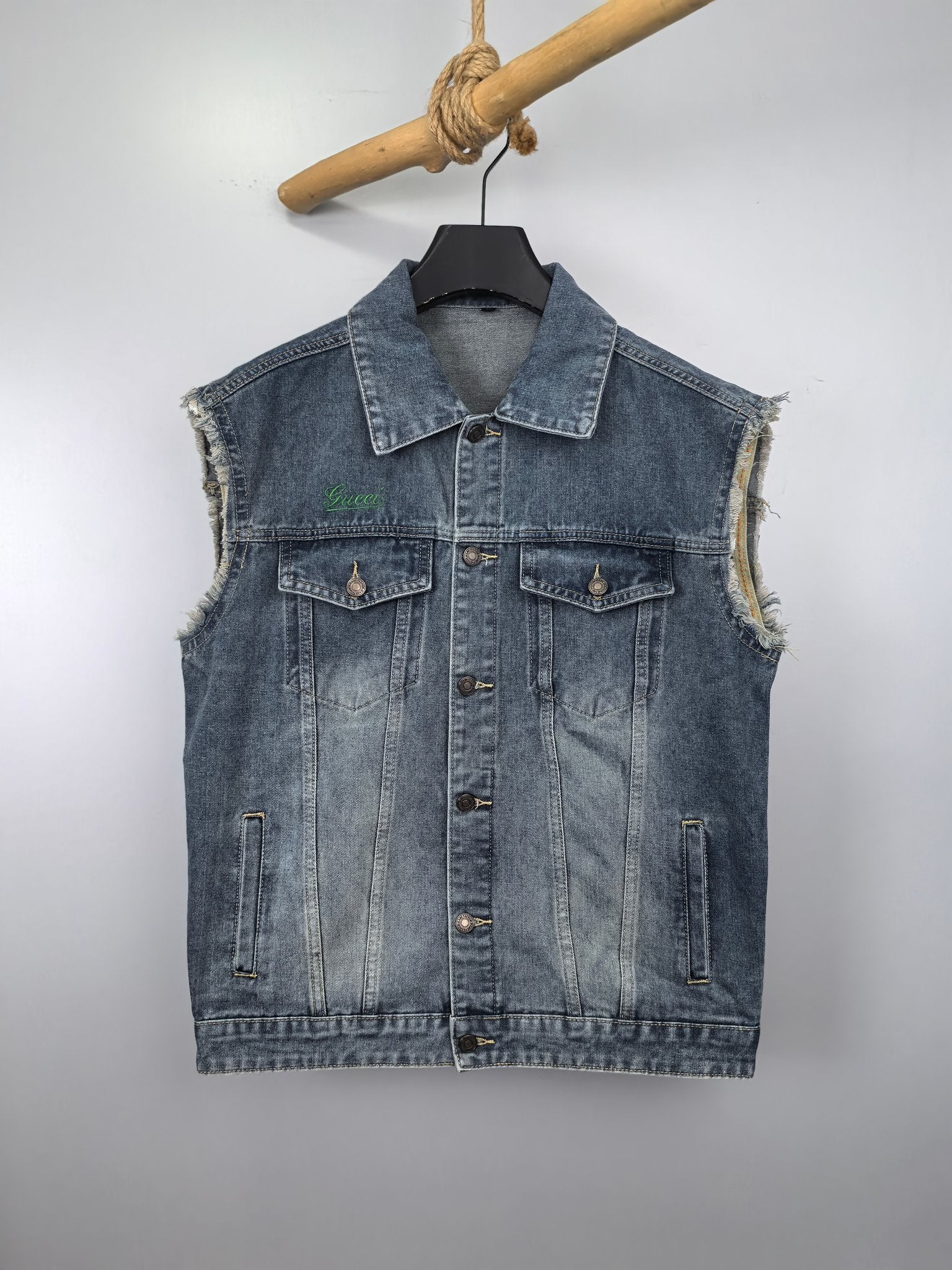 Gucci blue denim sleeveless jacket with button front and flap chest pockets