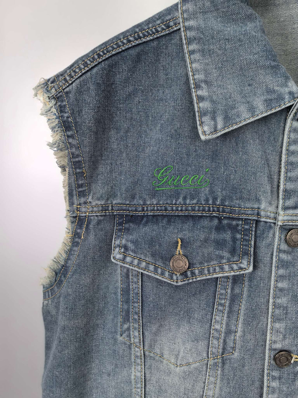 Gucci blue denim sleeveless jacket with frayed armhole edge and flap front pocket