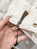 Gucci white puffer jacket zipper pull detail on front panel