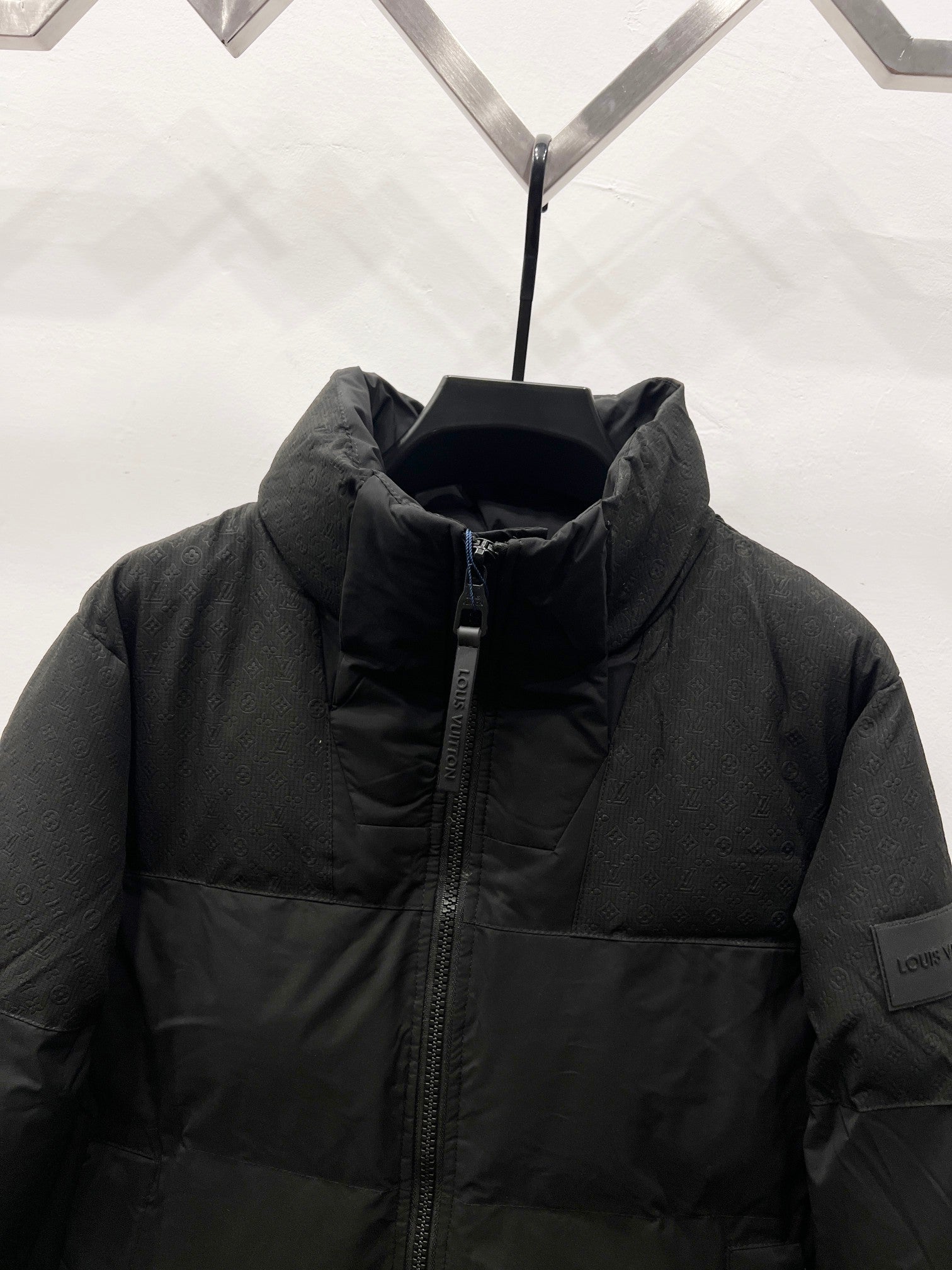 Puffer jacket collar close-up with full-length zipper