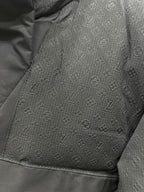 Dark gray monogram-pattern puffer jacket fabric panel