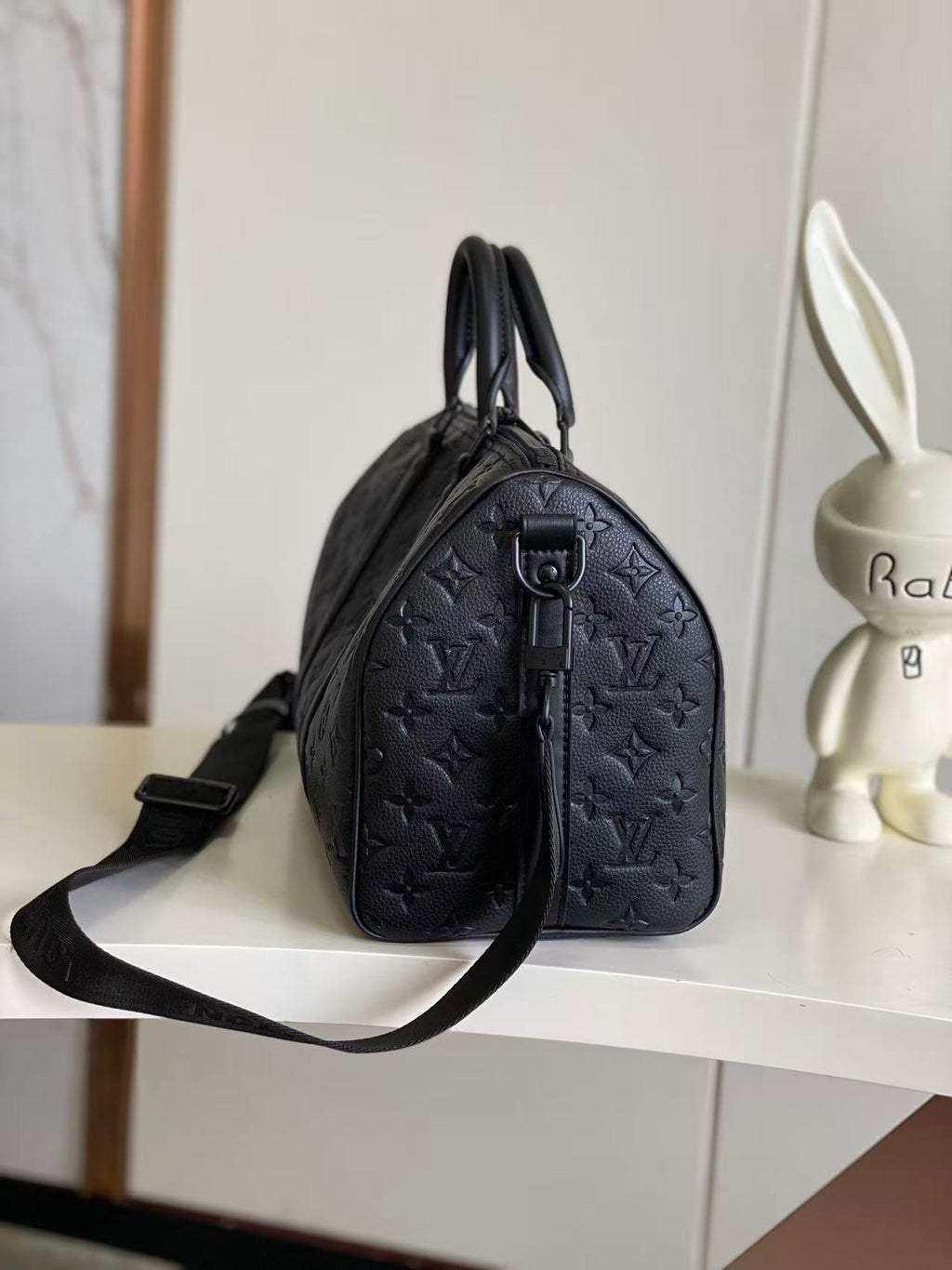 Louis Vuitton monogram satchel with top handle and long strap, dark navy