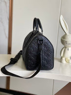 Louis Vuitton monogram satchel with top handle and long strap, dark navy