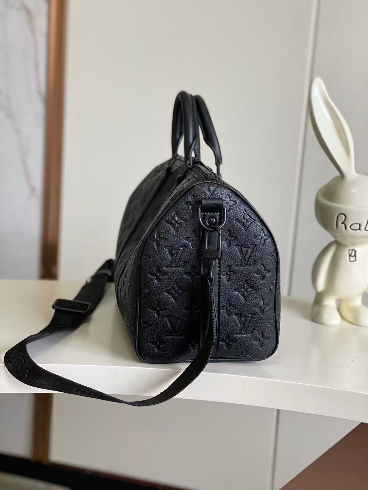 Louis Vuitton monogram satchel with top handle and long strap, dark navy