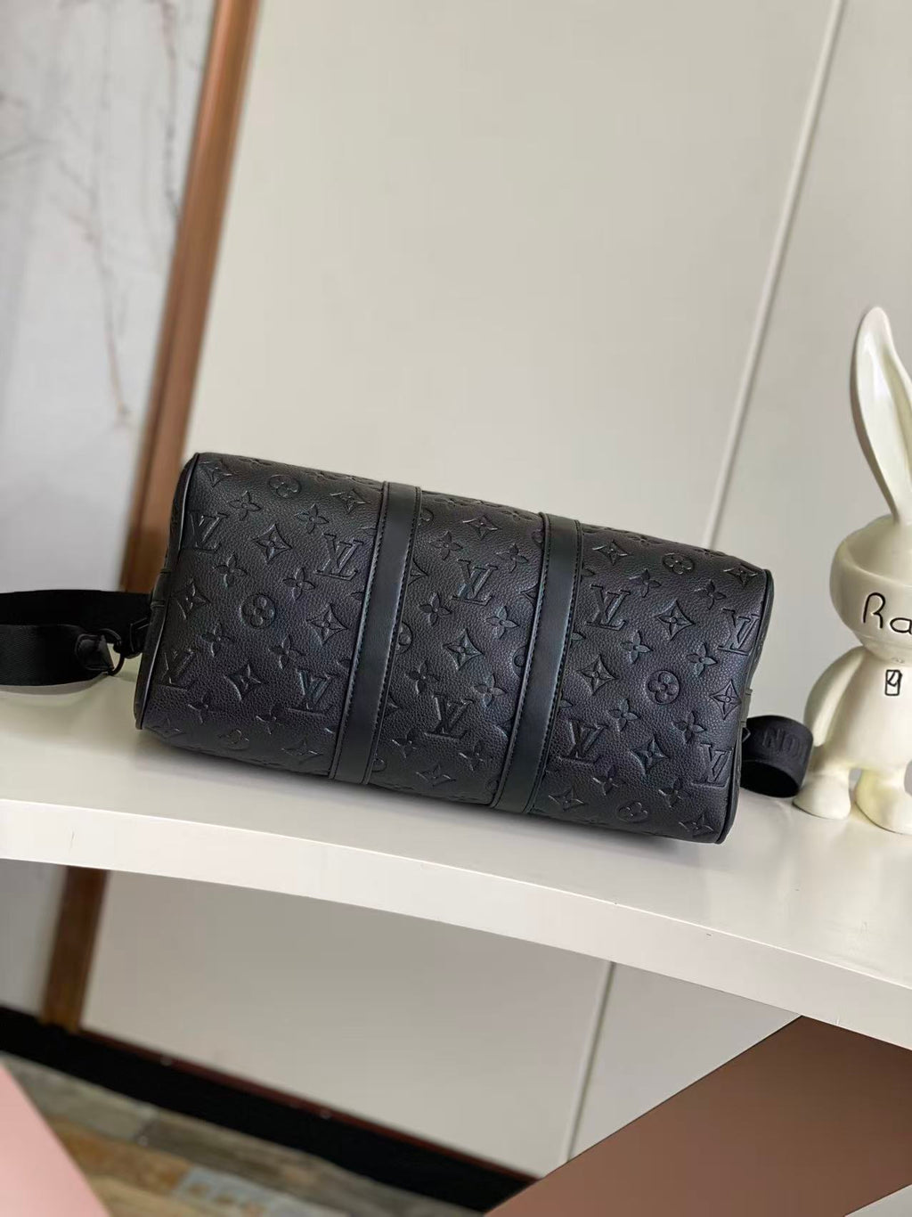 Louis Vuitton monogram duffel bag, dark navy cylinder shape with shoulder strap