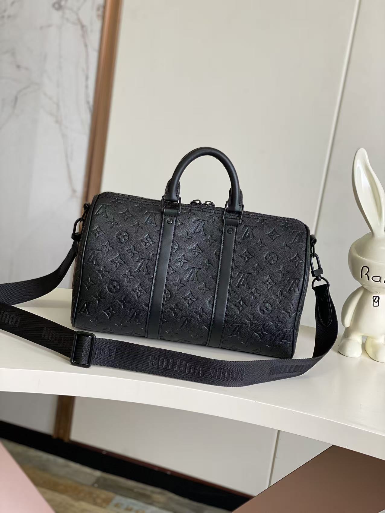 Louis Vuitton monogram duffel bag, dark navy with front vertical panel and strap