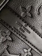 Louis Vuitton monogram leather with embossed flowers and stitched edge, dark navy
