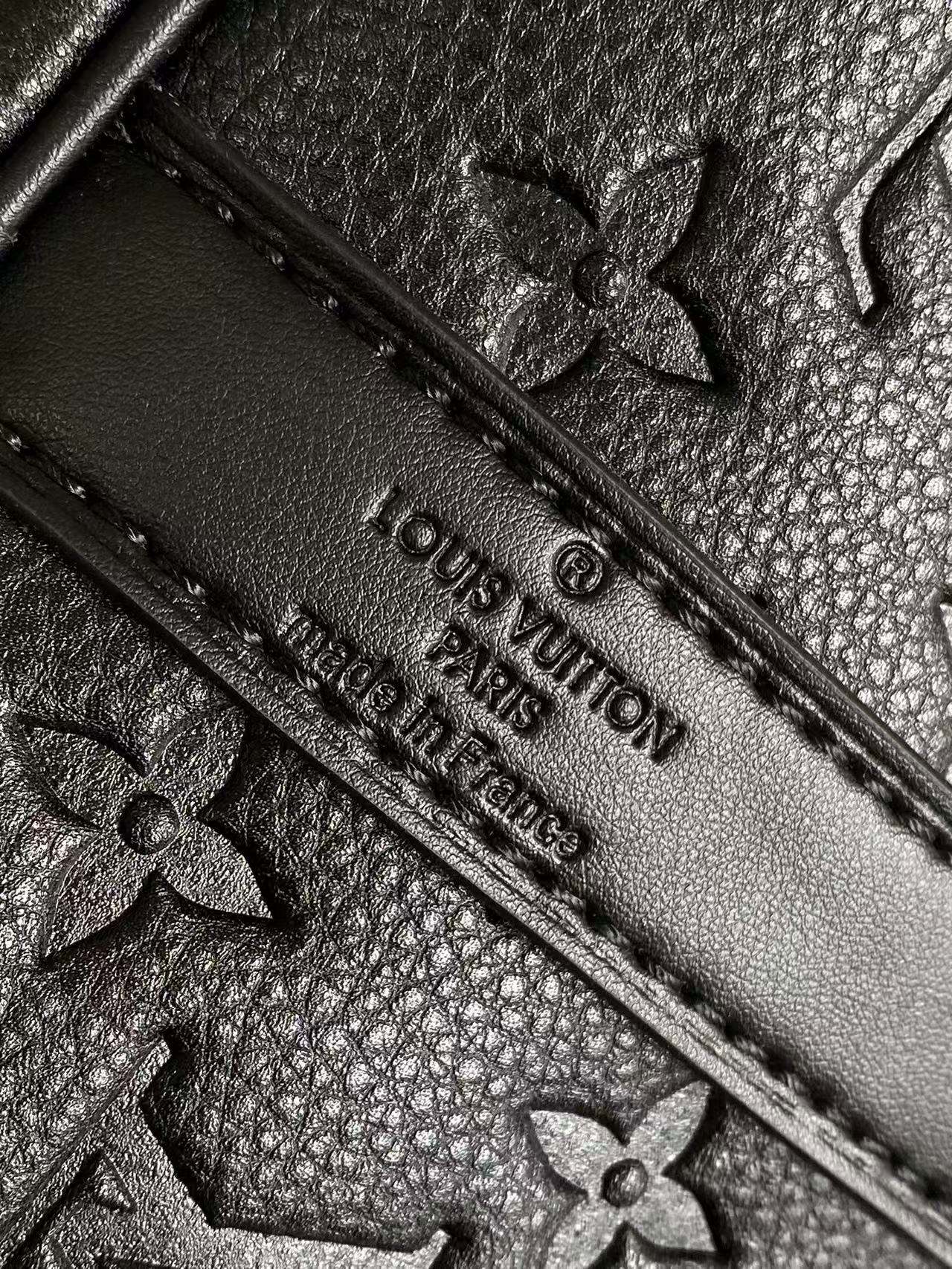 Louis Vuitton monogram leather with embossed flowers and stitched edge, dark navy
