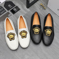 Versace loafers: black and white slip-on shoes with gold medallion accent