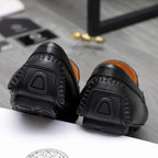 Versace black loafer heel and side tread with embossed panel detailing