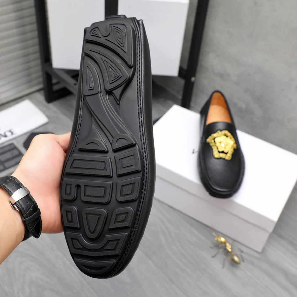 Versace loafer outsole with raised tread pattern and stitched edge