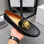 Versace black leather loafer with gold medallion front and orange lining