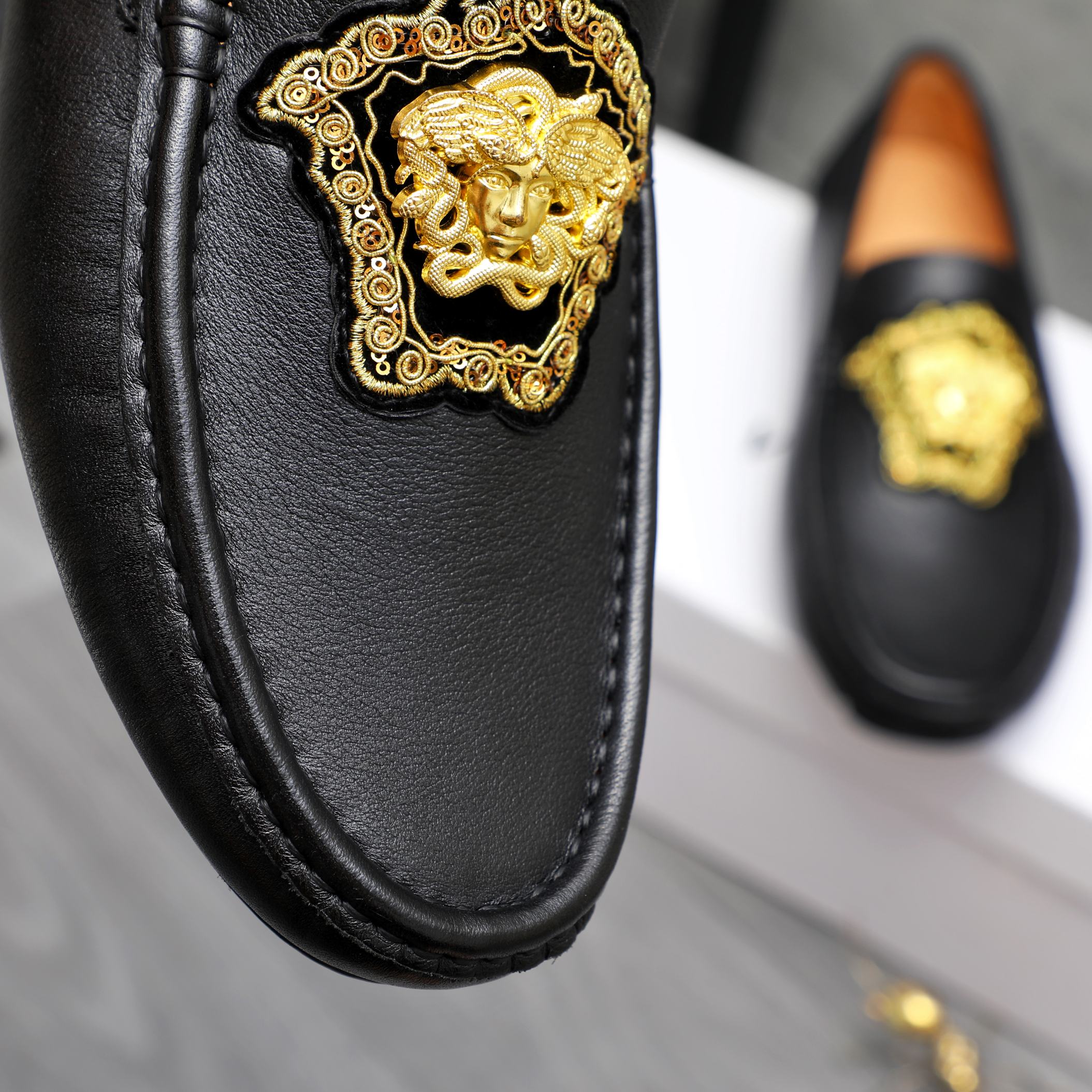 Versace black loafer upper with gold medallion emblem detail