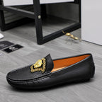 Versace black leather loafer with gold medallion and orange inner lining