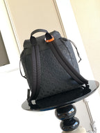Louis Vuitton monogram backpack in dark gray with top handle and front flap closure