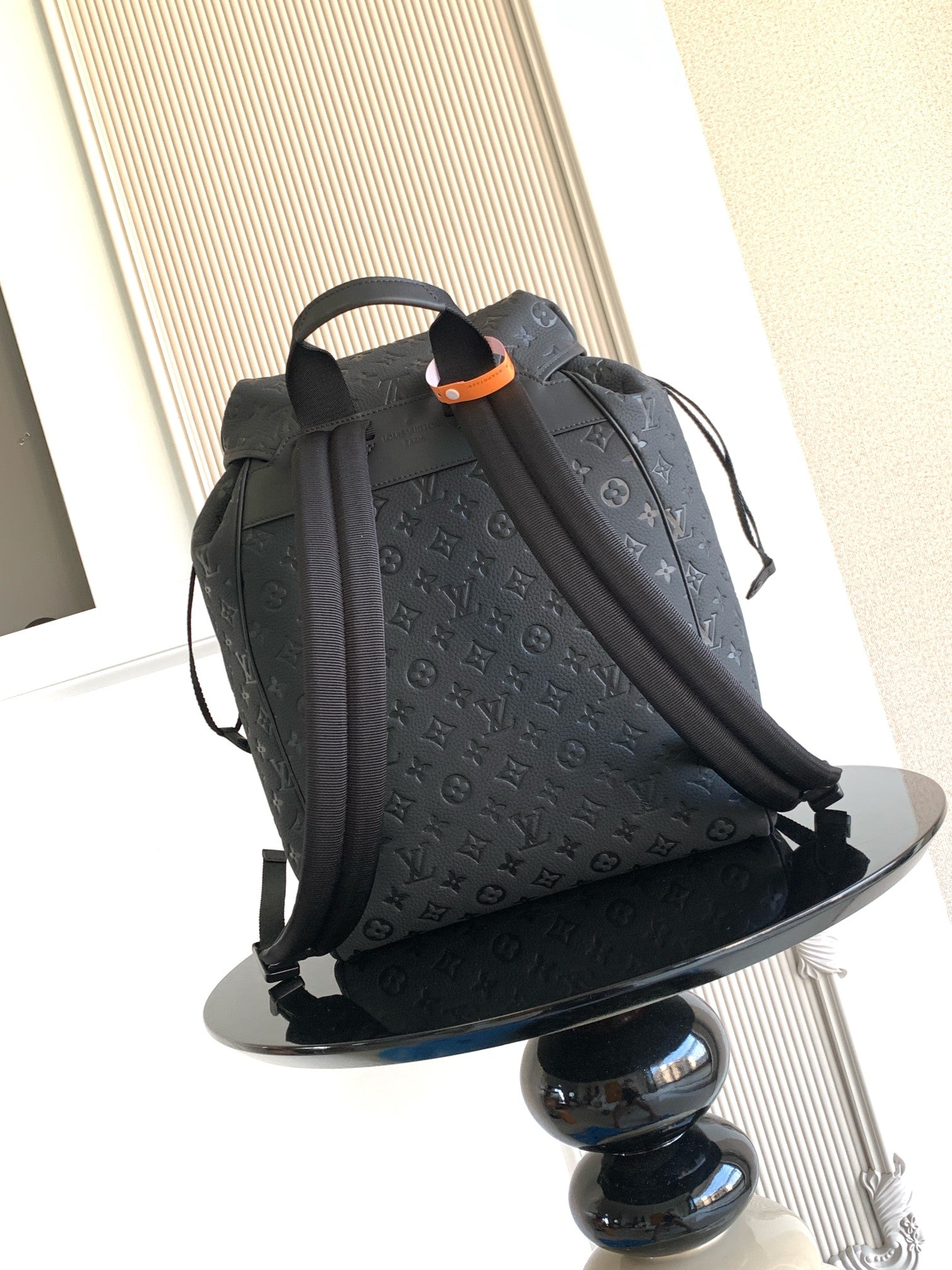 Louis Vuitton monogram backpack in dark gray with top handle and front flap closure