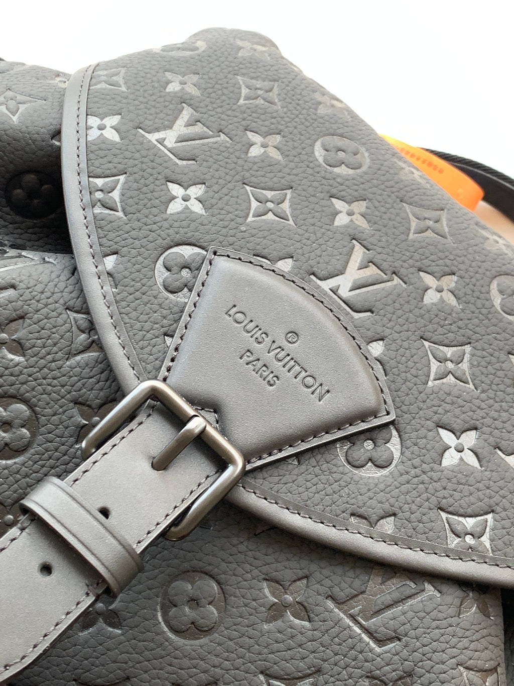 Louis Vuitton monogram backpack in light gray with stitched strap and rectangular metal buckle