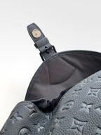 Louis Vuitton monogram backpack dark gray with leather strap loop and snap hardware