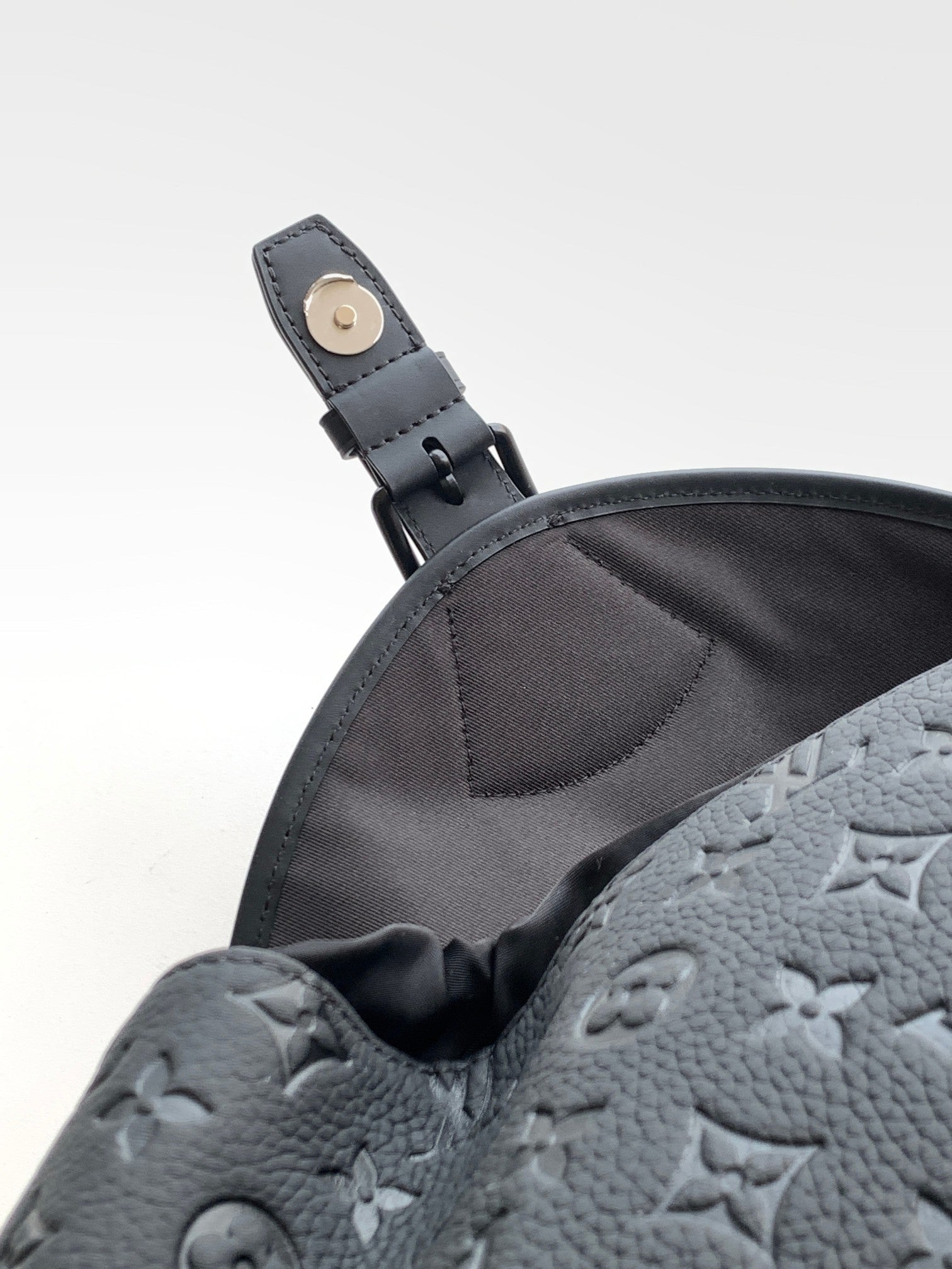 Louis Vuitton monogram backpack dark gray with leather strap loop and snap hardware