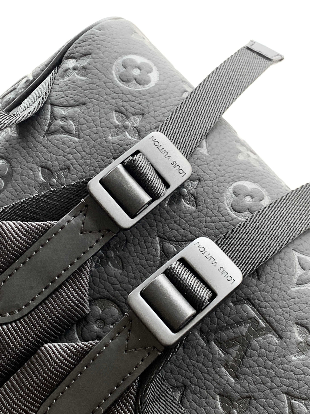 Louis Vuitton monogram backpack in light gray with silver-tone buckles and strap hardware